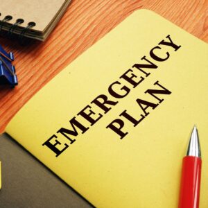 Yellow folder with the words "Emergency Plan" written on the front. 